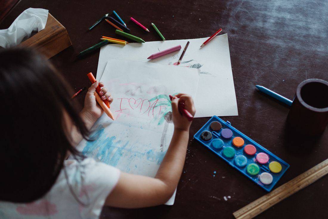 A child painting with watercolours