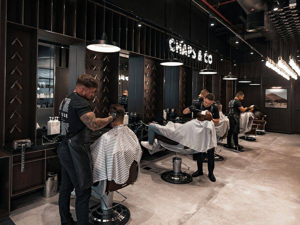 Barbers cutting hair on a busy day