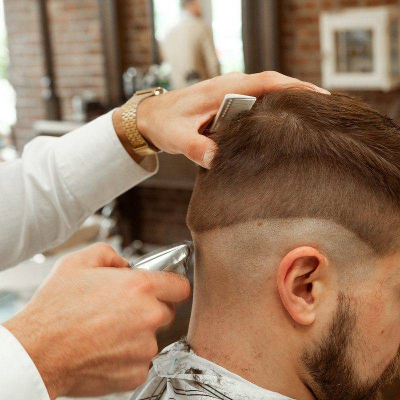 Barber finishing a skin fade