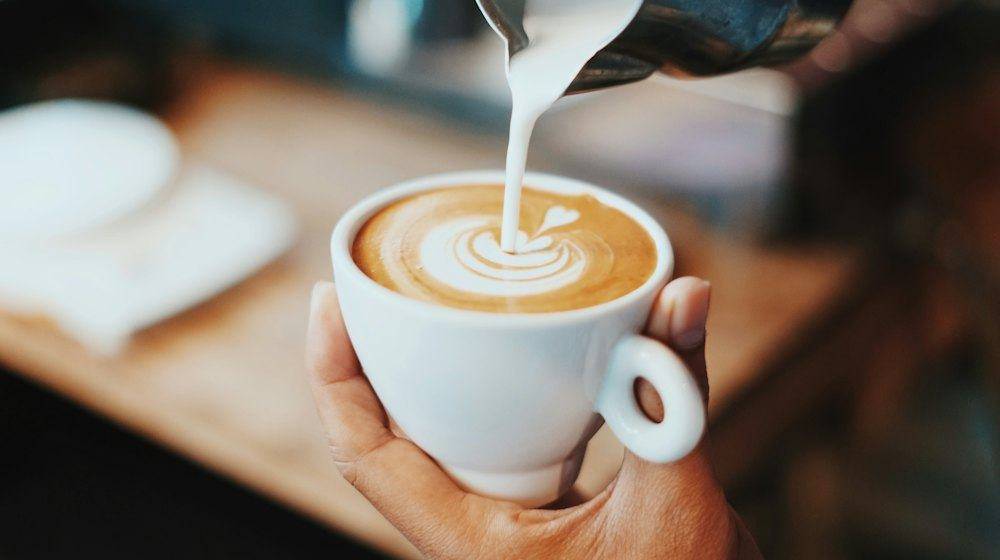 Milk poured into a latte