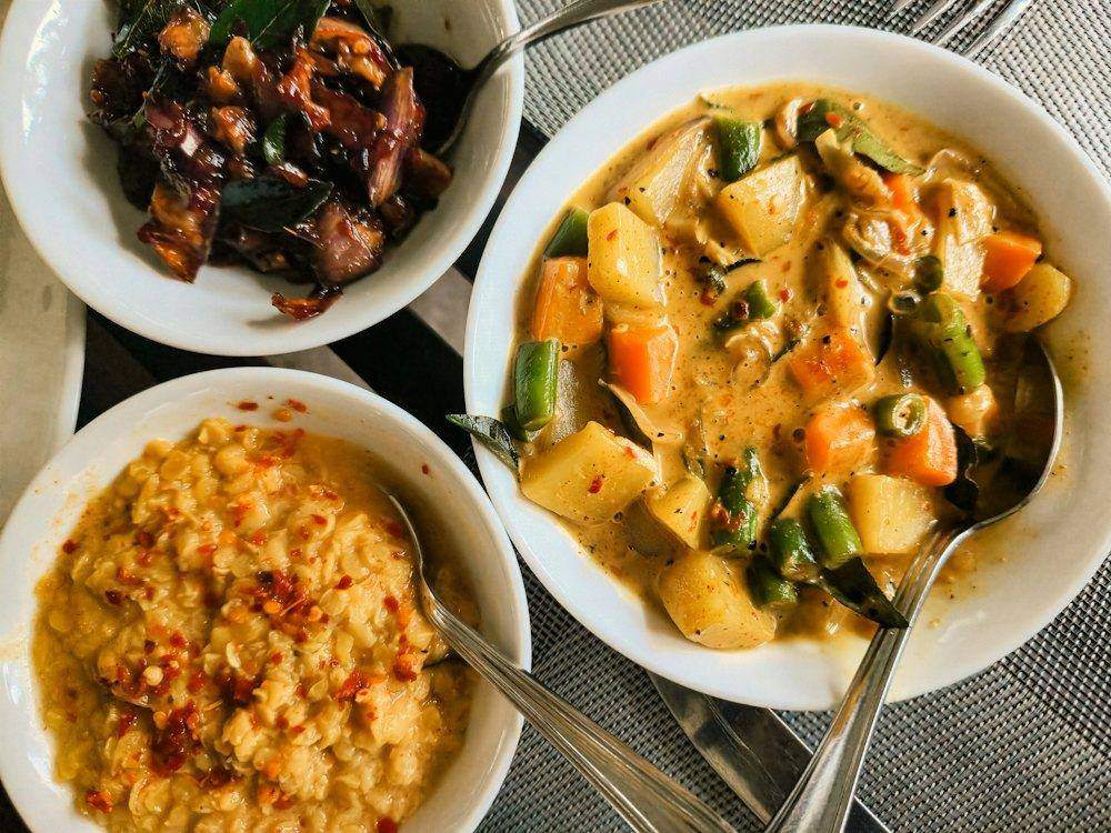 Several curries in bowls
