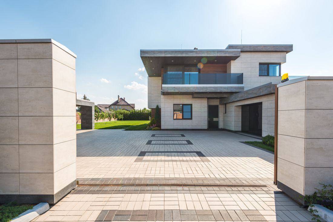 Two-storey modern house with a paved driveway